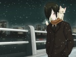 Un chico y su gato, paséan en la noche nevada