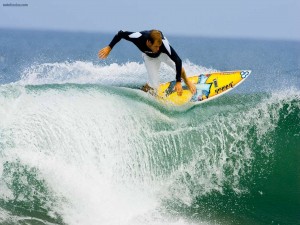 Postal: Surfeando sobre la cresta de la ola