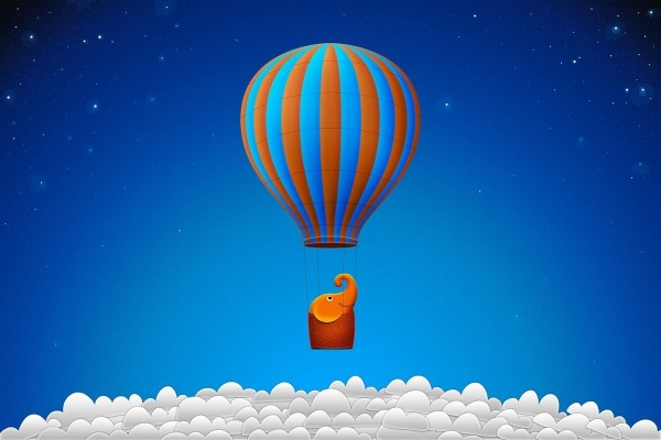 Elefantito viajando en globo sobre las nubes