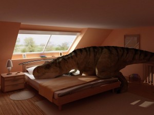 Un dinosaurio sobre la cama