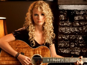 Postal: Taylor Swift tocando la guitarra