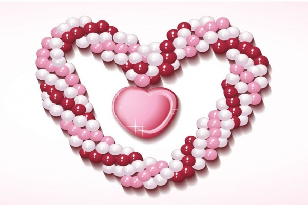 Corazón de perlas rosas y blancas