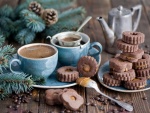 Galletas de chocolate con caramelo y tazas de café