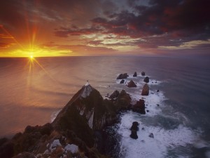 Postal: Últimos rayos de sol en el mar