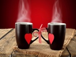Tazas negras con un corazón rojo