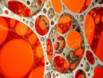 Círculos de acero sobre un fondo naranja