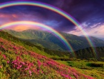 Doble arco iris sobre las montañas