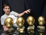 Lionel Messi con sus cuatro balones de oro