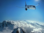 Un gran avión sobrevolando nubes y montañas