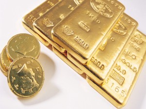 Monedas y lingotes de oro