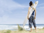 Un joven con su tabla de surf contemplando el mar
