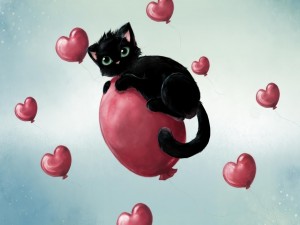 Gatito negro sobre un globo