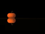 Calabaza de halloween reflejada en un fondo oscuro