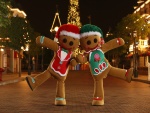Dos hombrecillos de jengibre bailando en una calle el día de Navidad