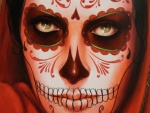 Pintura de una mujer maquillada el "Día de Muertos"