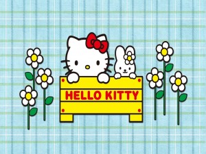 Hello Kitty y su amiga tras un cartel amarillo