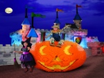 Niños con disfraces para Halloween junto a una calabaza de Lego