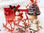Muñecos de nieve en un trineo navideño