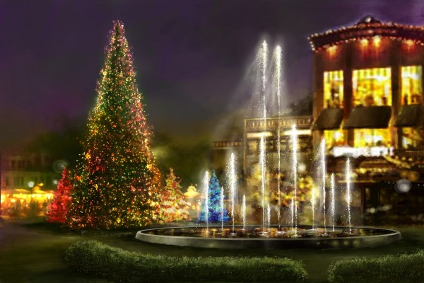 Árboles de Navidad iluminados junto a una fuente