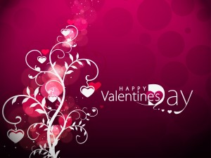 "Feliz Día de San Valentín" junto a un árbol con corazones