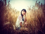Chica en un campo de trigo