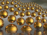 Múltiples esferas de color dorado emergiendo del agua