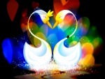 Pareja de cisnes rodeados de corazones de colores
