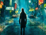 Hombre bajo la lluvia en una calle