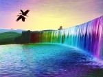Aves volando sobre una cascada de colores
