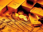 Billetes, monedas y lingotes de oro