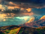 Sol iluminando el valle y las montañas