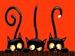 Tres gatos negros en la noche de Halloween