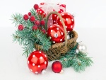 Cesta con bolas, ramas y regalo para Navidad