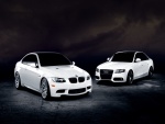 Un Audi y un BMW de color blanco