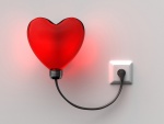 Corazón conectado a una toma de corriente eléctrica