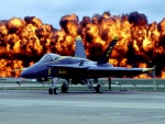 Fuego tras un avión militar