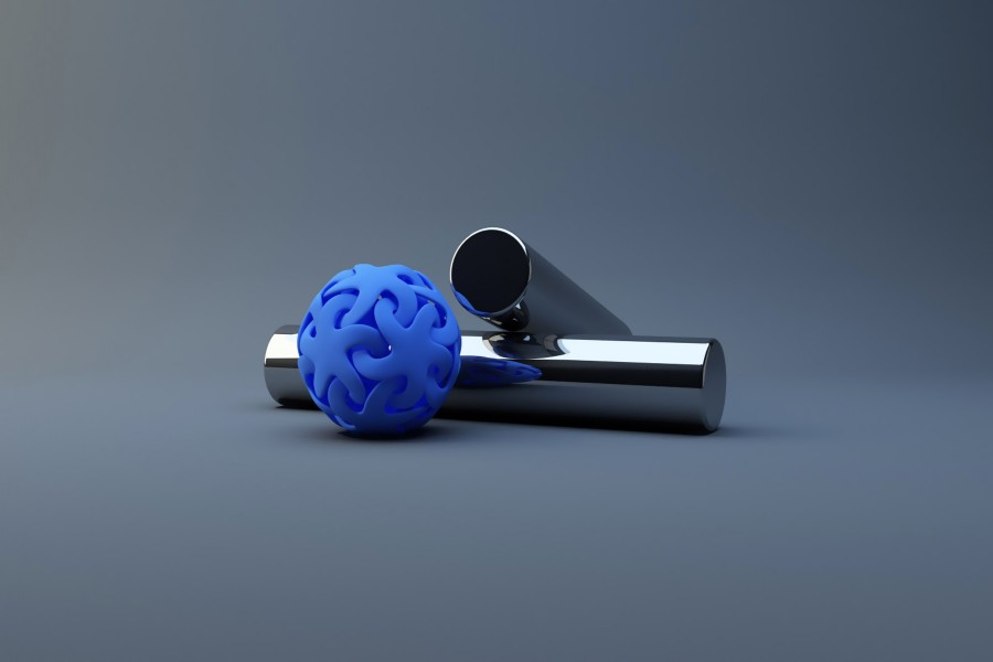 Pelota de goma azul y cilindros de metal